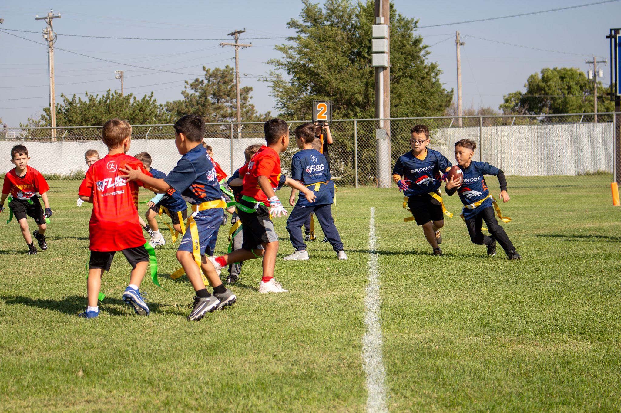 Young boy is running the football